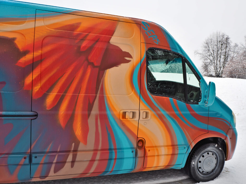 painted bird on vehicle